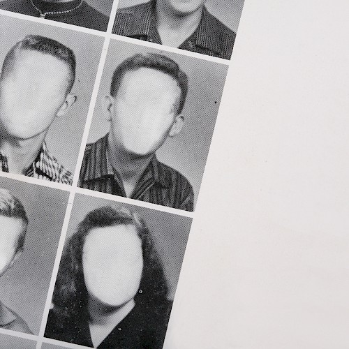 A grid of black-and-white yearbook photos with blurred-out faces, placed diagonally across the image.