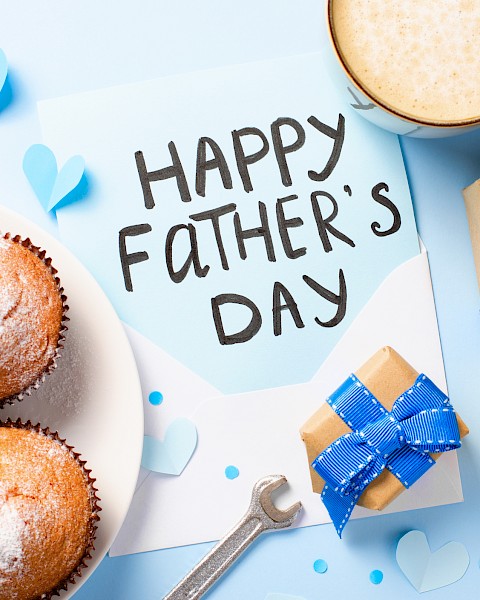 Celebrating Father's Day with cupcakes, a gift, a heartfelt note, and a cup of coffee or tea.