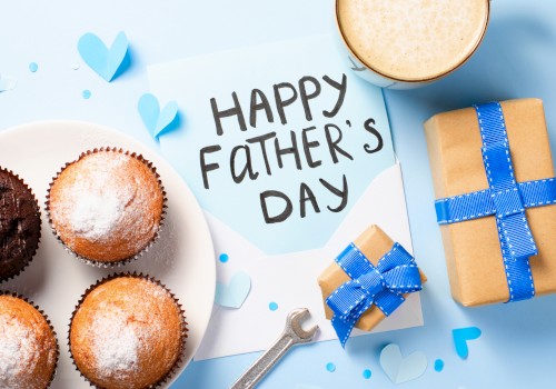 Celebrating Father's Day with cupcakes, a gift, a heartfelt note, and a cup of coffee or tea.
