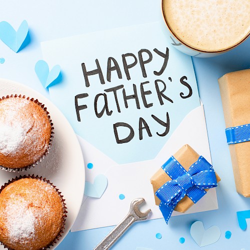 Celebrating Father's Day with cupcakes, a gift, a heartfelt note, and a cup of coffee or tea.