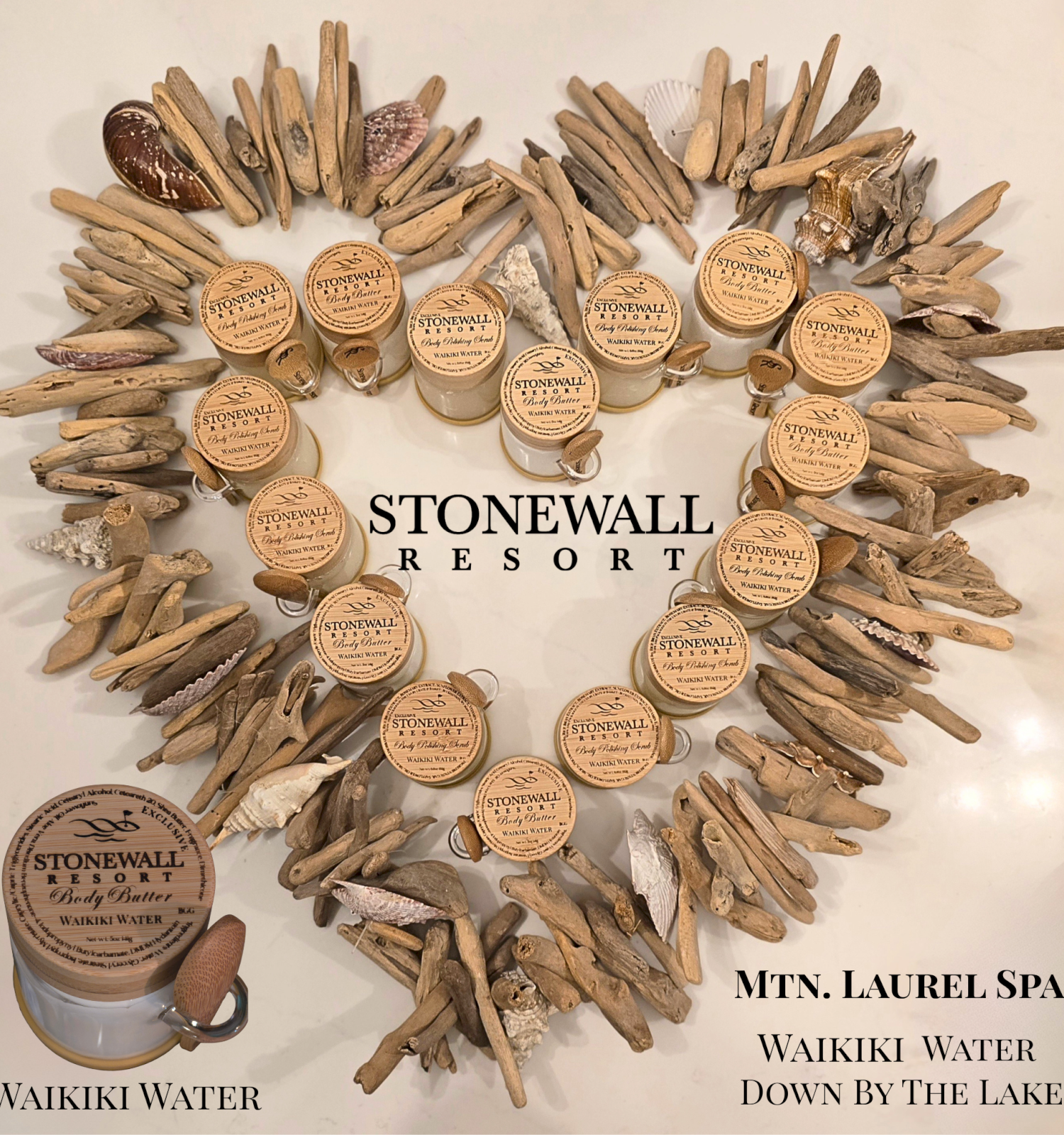 The image shows a heart-shaped arrangement of small containers of body butter, surrounded by driftwood and shells, with a sign for Mountain Laurel Spa.