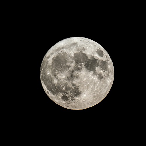 The image shows a clear, detailed view of the full moon set against a dark background. The surface features and craters are visible.